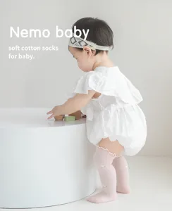 Breathable mesh knee high socks for baby infants with cute ruffles and soft cotton.