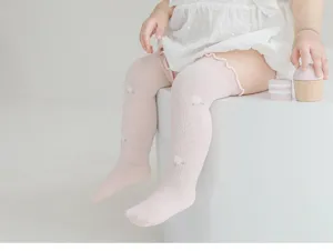 Detailed view of baby mesh high socks in pink, featuring lace trim and breathable cute design.