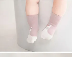 Infant anti-slip toddler socks detail view, cute cartoon goose pattern, soft fabric.