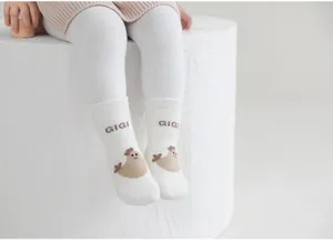 Detail view of infant toddler floor socks in white cotton with cute chicken knit pattern.