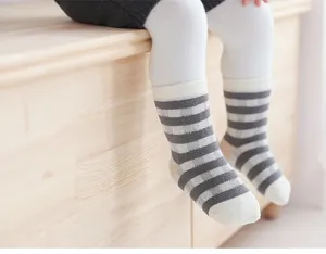 Close-up detail of cozy thickened striped baby socks, soft and warm for infants daily wear.