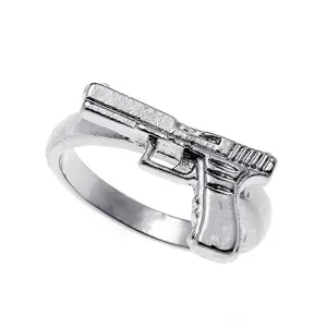 Close-up detail of silver alloy pistol ring, punk style men's fashion jewelry showcase shot.