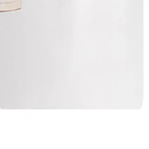 Detail view of the waterproof cosmetic bag material and small tag in white color.