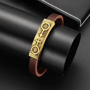 Nahaufnahme des Vintage Lederarmbands für Paare mit Messing Geschlechtssymbol Platte.