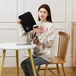 Detailed view of the black 11-inch tablet sleeve with adjustable strap and cute smiling logo.