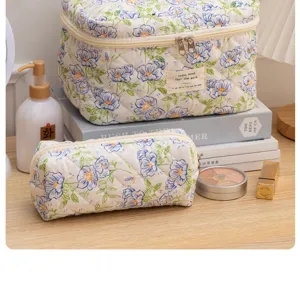 Detailed view of the cute floral quilted cosmetic bag set, featuring soft fabric and neat stitches.