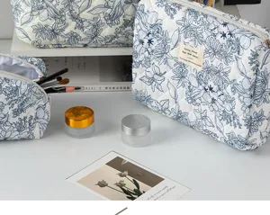 Quilted floral cosmetic bag, portable cotton makeup pouch and toiletry storage organizer.