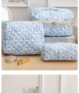 Blue floral quilted cosmetic bag set, portable makeup storage pouch and toiletry organizer.