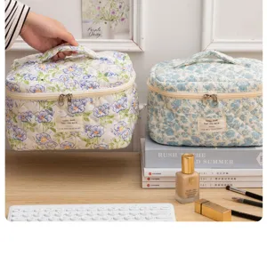 Quilted floral cosmetic bag, cute portable makeup storage pouch with handle for daily travel.