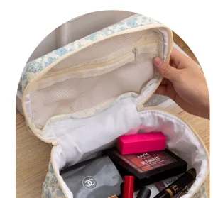 Floral quilted cosmetic bag with large capacity, cute portable makeup storage pouch.