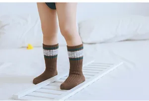 Detailed view of children striped high tube combed cotton socks for autumn and winter.