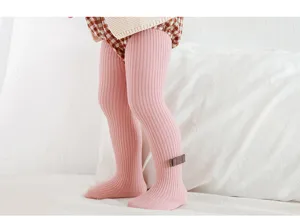 Toddler pink ribbed tights detail, soft warm knit baby leggings with cute bow accent.