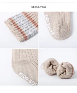 Detailed view of newborn baby non-slip cotton socks showing ribbed cuffs and grip soles.