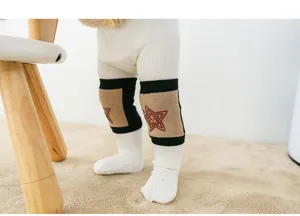 Baby crawling knee protector detail shot, anti-fall toddler safety gear close up view.