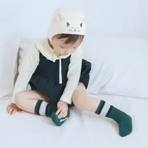 Cute infant anti-slip long socks with cat ear hat, soft combed cotton for daily baby wear.