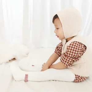 Comfortable fleece-lined children's tights with cute bow design, perfect for warm winter wear.