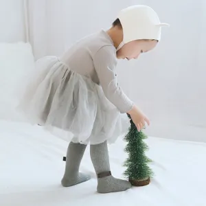 Cute baby ribbed tights for infant girls, soft cotton toddler leggings with bow for autumn wear.