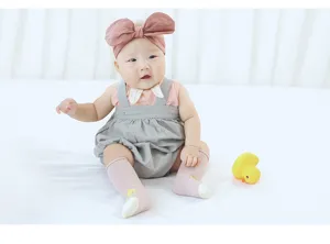 Detailed view of cute baby knee high socks featuring adorable cartoon duck patterns, soft and cozy.