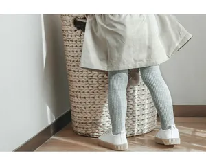 Children ribbed tights detail view, soft cotton knit leggings in grey, comfortable daily wear.