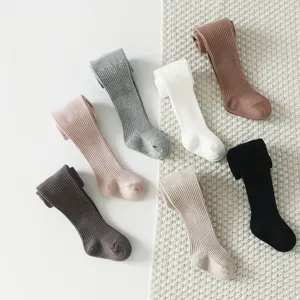 Comfortable ribbed cotton baby tights in various colors, soft footed leggings for infants.