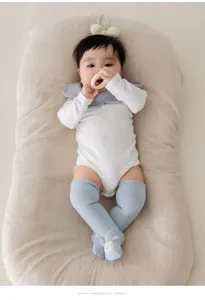Baby over-the-knee cotton socks with cute 3D ears, soft newborn knee-high hosiery details.