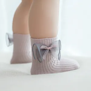 Cute infant baby socks featuring a sweet bow design, soft cotton fabric, comfortable and stylish.
