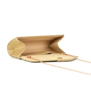 Detail view of the glitter evening clutch bag interior, featuring smooth lining and convenient pocket.