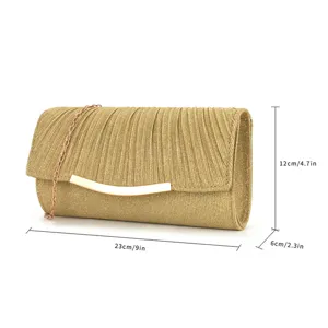 Gold pleated evening clutch bag detail showing texture and metal chain sizing details.