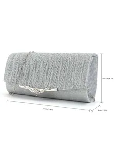 Detailed view of the silver glitter evening clutch bag, showing shimmering texture and clasp details.