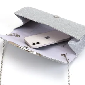 Silver glitter evening clutch bag with chain strap, stylish party handbag detail view.