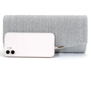 Silver glitter evening clutch bag for women, elegant sparkly party purse for events.