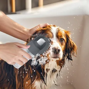 Multifunctional pet bath brush with silicone massage bristles for easy dog and cat cleaning.