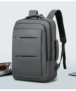 Vue détaillée du sac à dos de voyage d'affaires gris avec plusieurs compartiments.