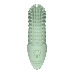 Green silicone pet finger toothbrush with soft bristles for dog and cat dental oral care.