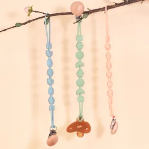 Silicone baby pacifier clips set with wooden clips and teether hanging display main view