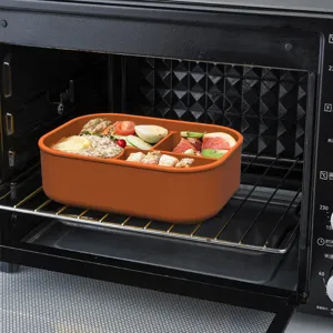 Silicone bento lunch box with partitioned compartments, heat-resistant food container.