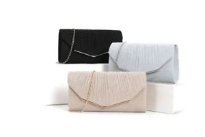 Elegant evening clutch bag detail showcasing pleated shimmer texture and metal V-shaped hardware.