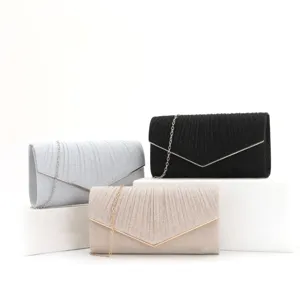 Glitter evening clutch bag details, metallic V-flap and chain strap, elegant party purse.
