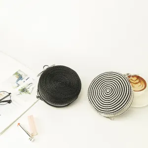 Handmade woven round crossbody bag with chain strap, stylish clutch for women.