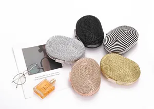 Woven oval evening clutch bag for women, stylish crossbody chain bag with crystal clasp.