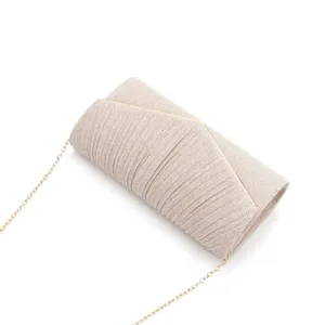 Stunning champagne evening clutch bag featuring a V-shaped pleated design and chain strap.