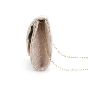 Side detail view of a stylish glitter evening clutch bag with delicate gold chain strap.