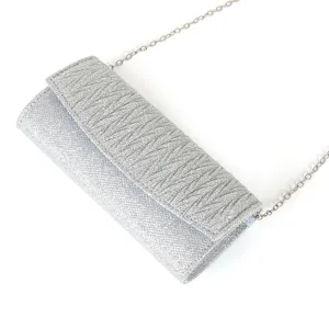 Silver glitter evening clutch bag detail view, featuring pleated flap and metal chain strap.