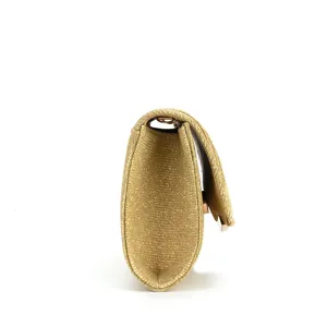 Gold glitter evening clutch bag side view detail showing sleek profile and texture.