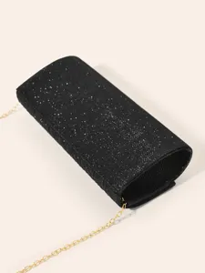 Black glitter evening bag for women, elegant clutch with gold chain strap detail.