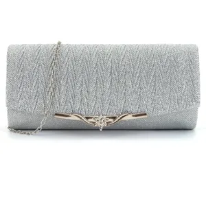 Close up view of the silver glitter evening clutch bag showing fine texture and metallic clasp.