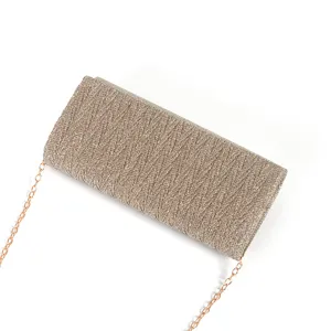 Detailed view of the sparkling pleated evening clutch bag with metallic chain strap.