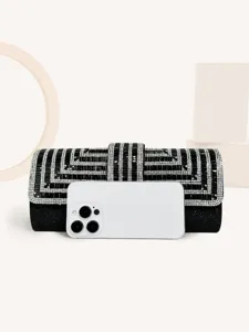 Black rhinestone evening clutch bag with geometric crystal pattern and flap closure.