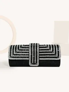 Close-up details of the elegant black crystal evening clutch with sparkling rhinestones.