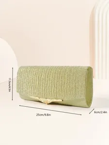Gold glitter evening clutch detail shot, featuring sparkling finish and elegant metal clasp.